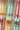 Multiple cans of BUCÏ Hard Kombucha flavours stacked on each other.