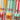 Multiple cans of BUCÏ Hard Kombucha flavours stacked on each other.